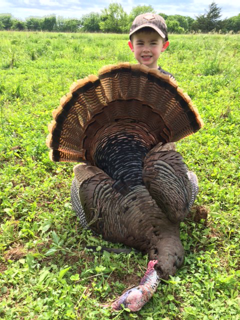 Platt Wilmoth with is first bagged turkey. He is with his dad, Brandon in picture above.