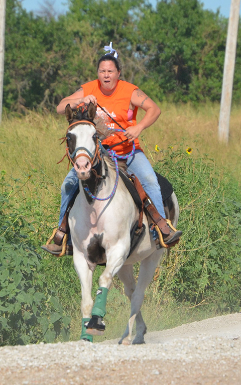 Tammy Mansfield of Wellington rides a horse for Team Dad Bod