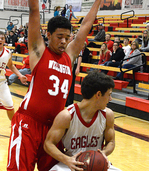 Khali Boyer defends the basket in double overtime game against Kingman.